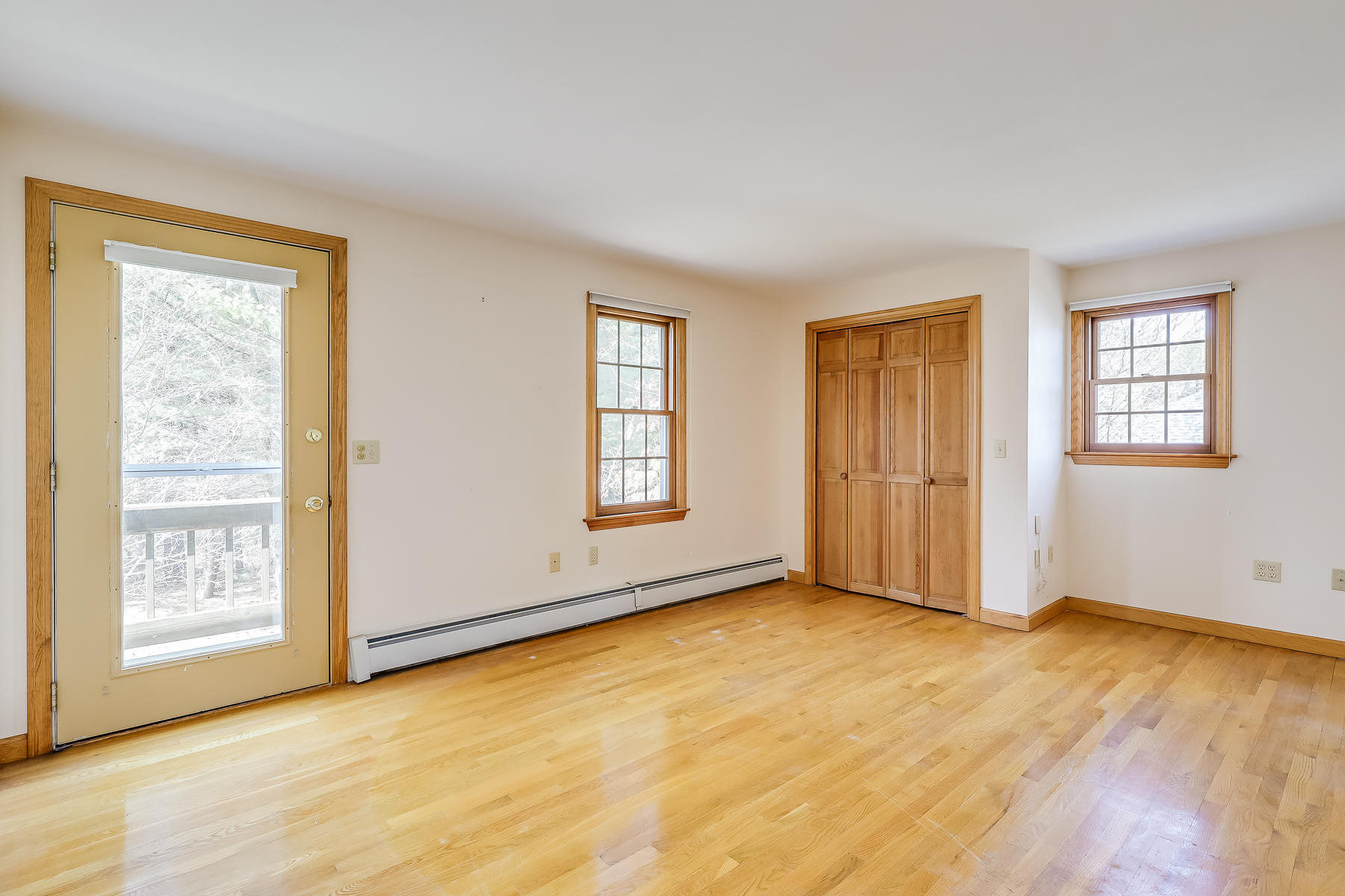 40 Meadowbrook Road Mashpee, MA 02649 - Photo 22 of 31 a view of an empty room with window and wooden floor