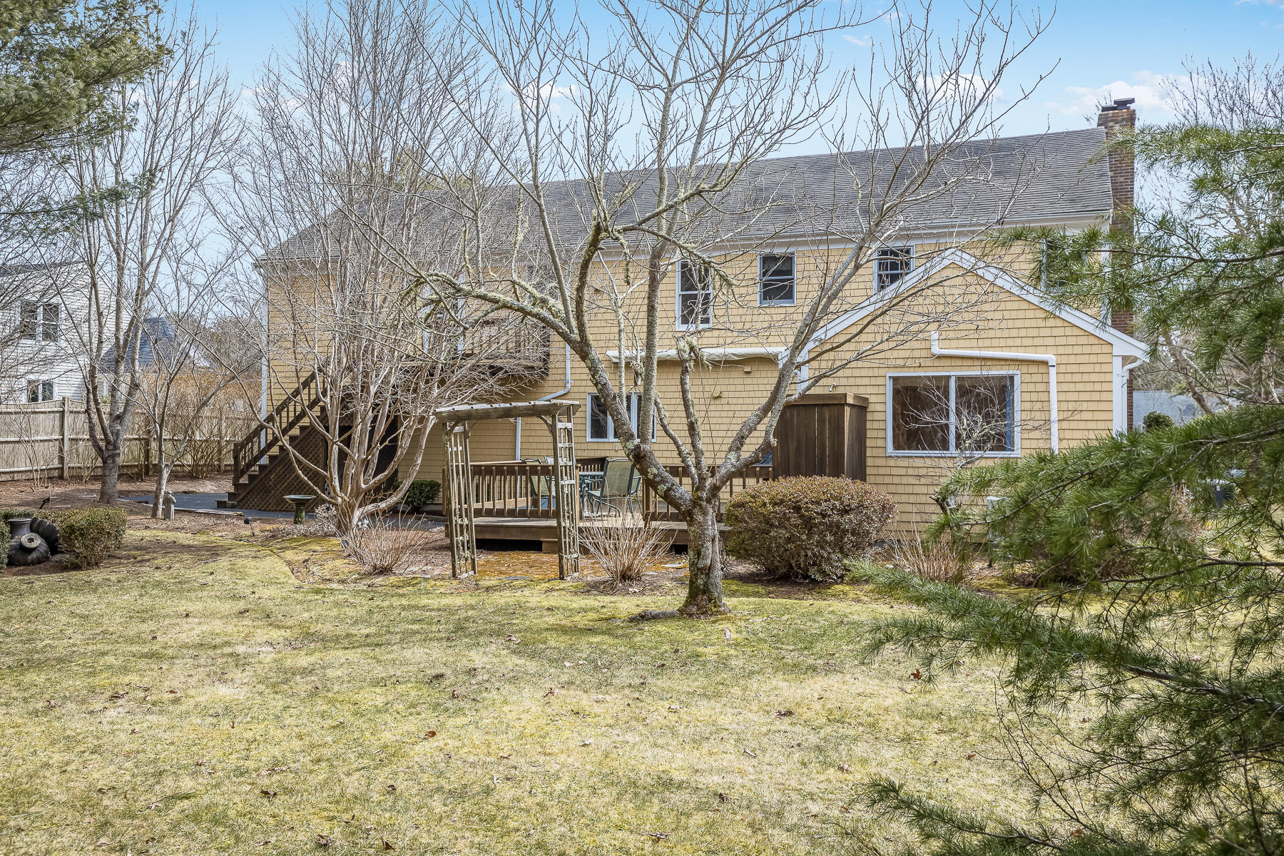 40 Meadowbrook Road Mashpee, MA 02649 - Photo 24 of 31 a front view of a house with a yard