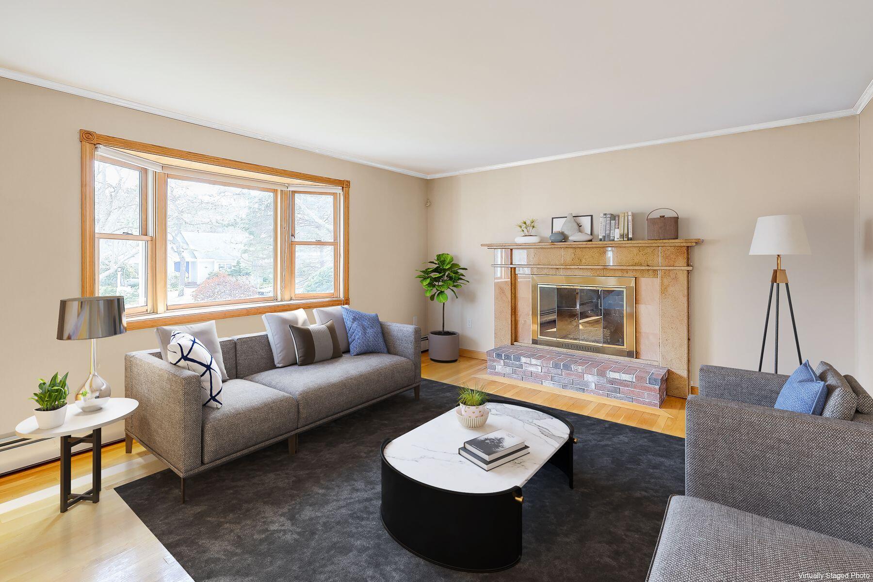 40 Meadowbrook Road Mashpee, MA 02649 - Photo 3 of 31 a living room with furniture and a fireplace