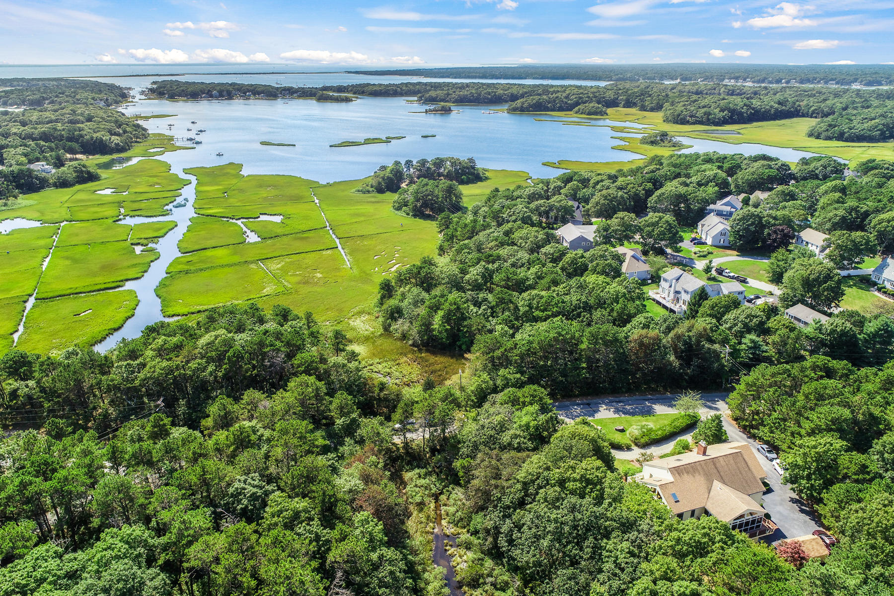 40 Meadowbrook Road Mashpee, MA 02649 - Photo 29 of 31 a view of a water pond with green field