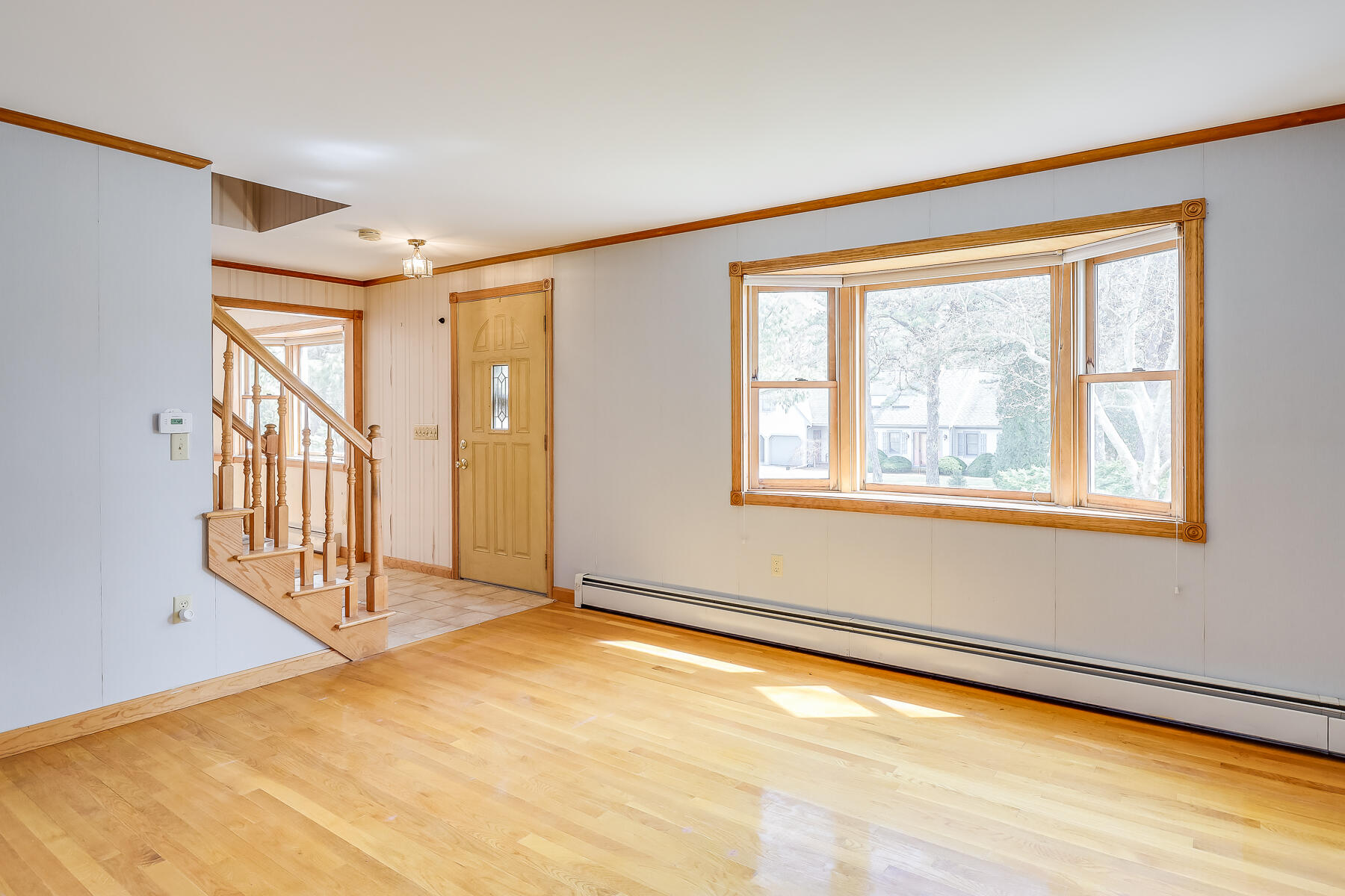 40 Meadowbrook Road Mashpee, MA 02649 - Photo 4 of 31 a view of an empty room with a window
