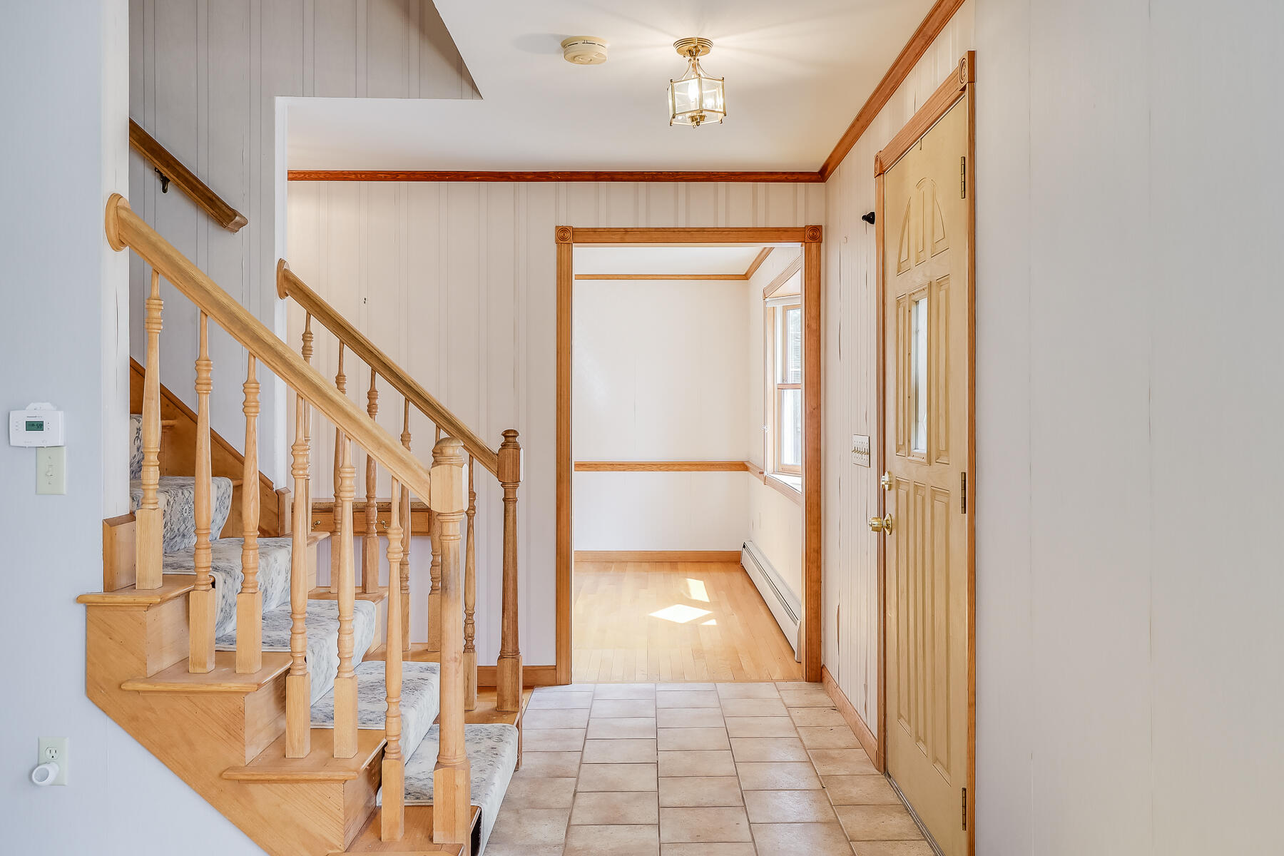 40 Meadowbrook Road Mashpee, MA 02649 - Photo 5 of 31 a view of a hallway with wooden floor and staircase