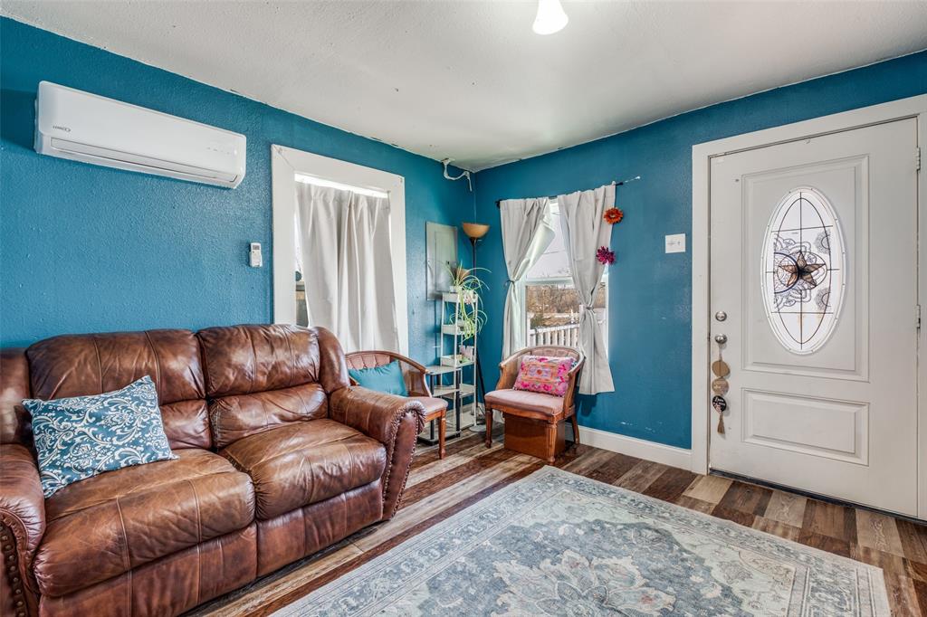 4755 Yancy Street Dallas, TX 75216 - Photo 2 of 12 a living room with furniture and wooden floor