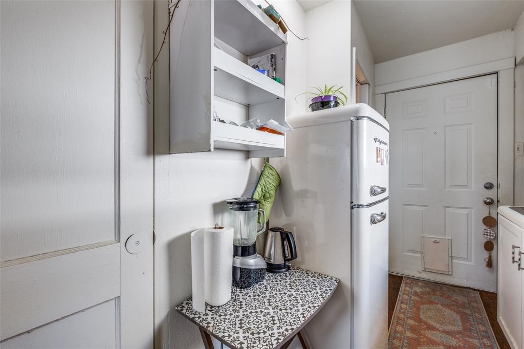 4755 Yancy Street Dallas, TX 75216 - Photo 6 of 12 a kitchen with a refrigerator and a stove