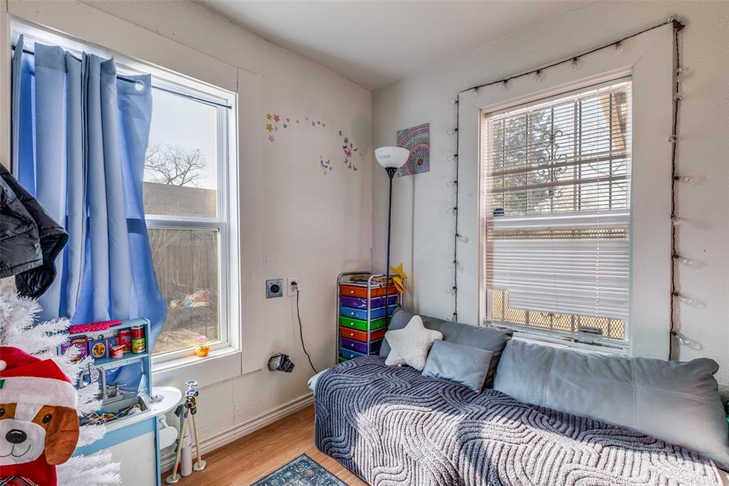 4755 Yancy Street Dallas, TX 75216 - Photo 7 of 12 a bedroom with a bed and a window