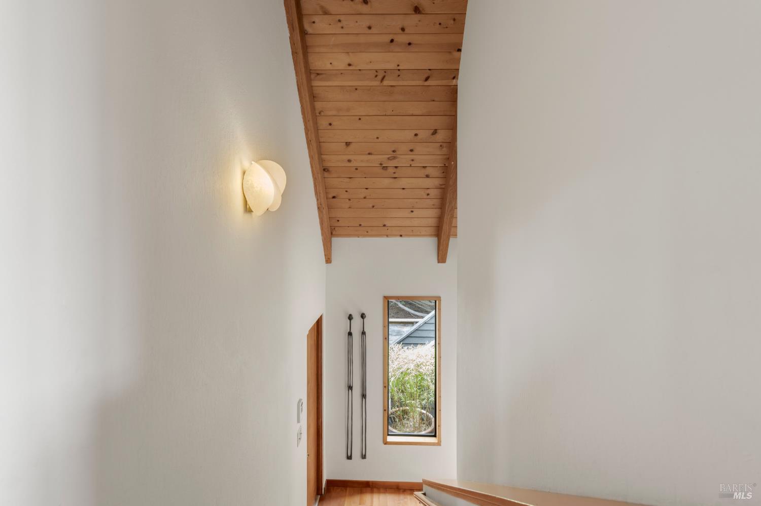 41322 Tallgrass The Sea Ranch, CA 95497 - Photo 18 of 33 Staircase down to solarium, office, primary bedroom and bath, with laundry.