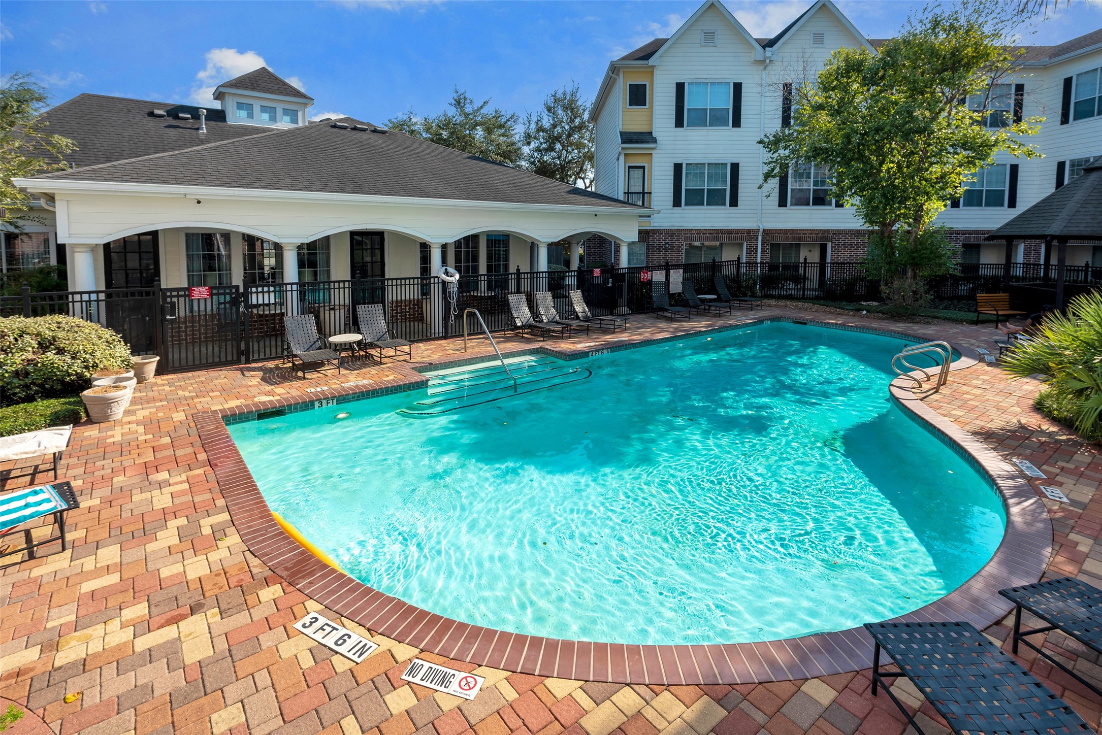 9200 Westheimer Road, Unit 1309 Houston, TX 77063 - Photo 1 of 28 an outdoor space with swimming pool and furniture