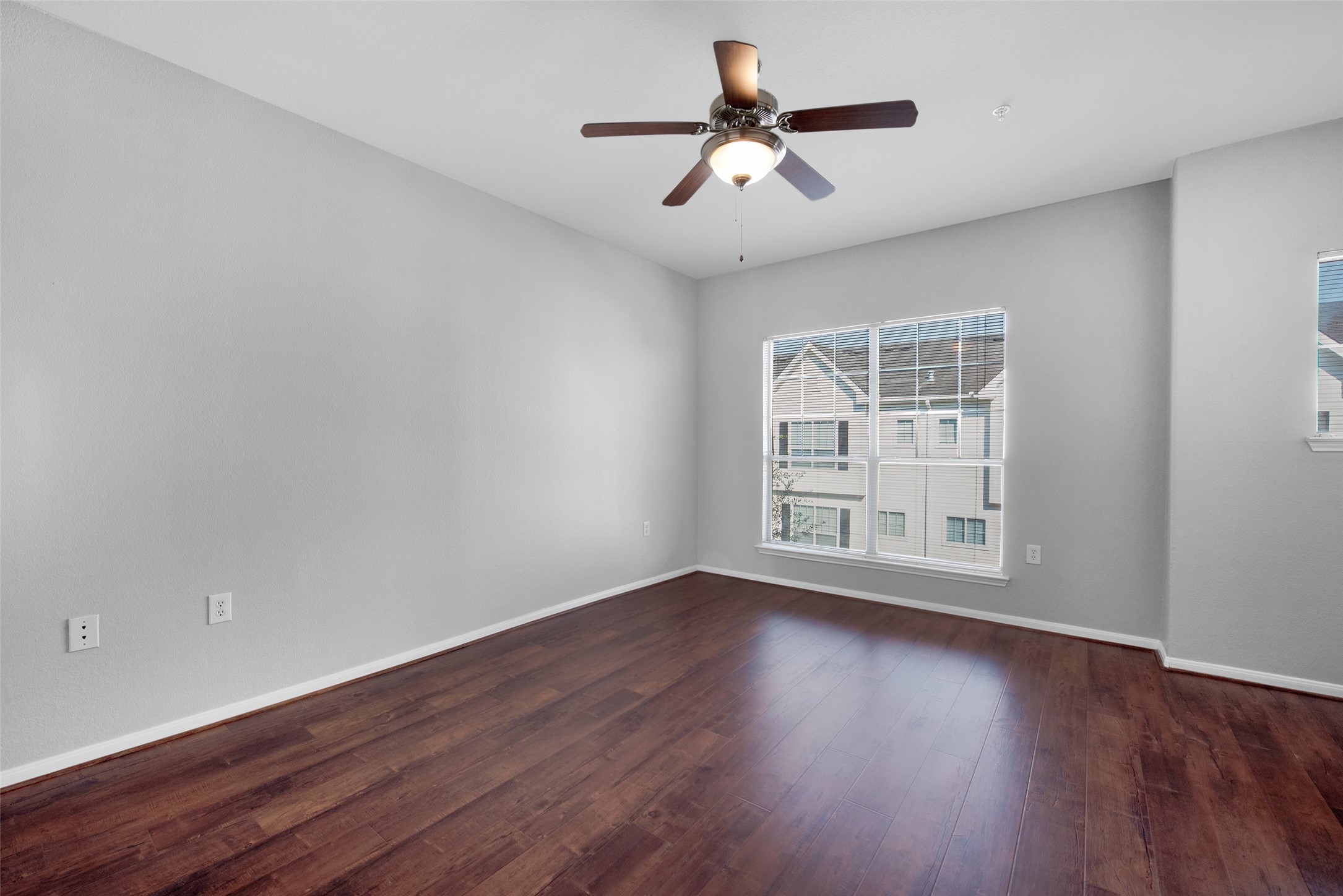 9200 Westheimer Road, Unit 1309 Houston, TX 77063 - Photo 12 of 28 a view of wooden floor and windows in a room