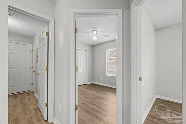 a view of room with window and hardwood