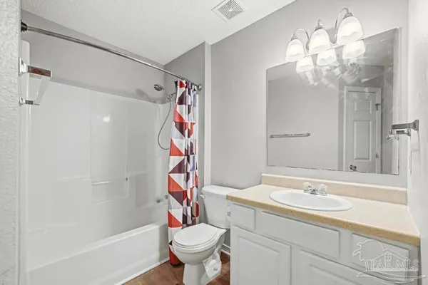 a picture of a room with a white wall and a large window