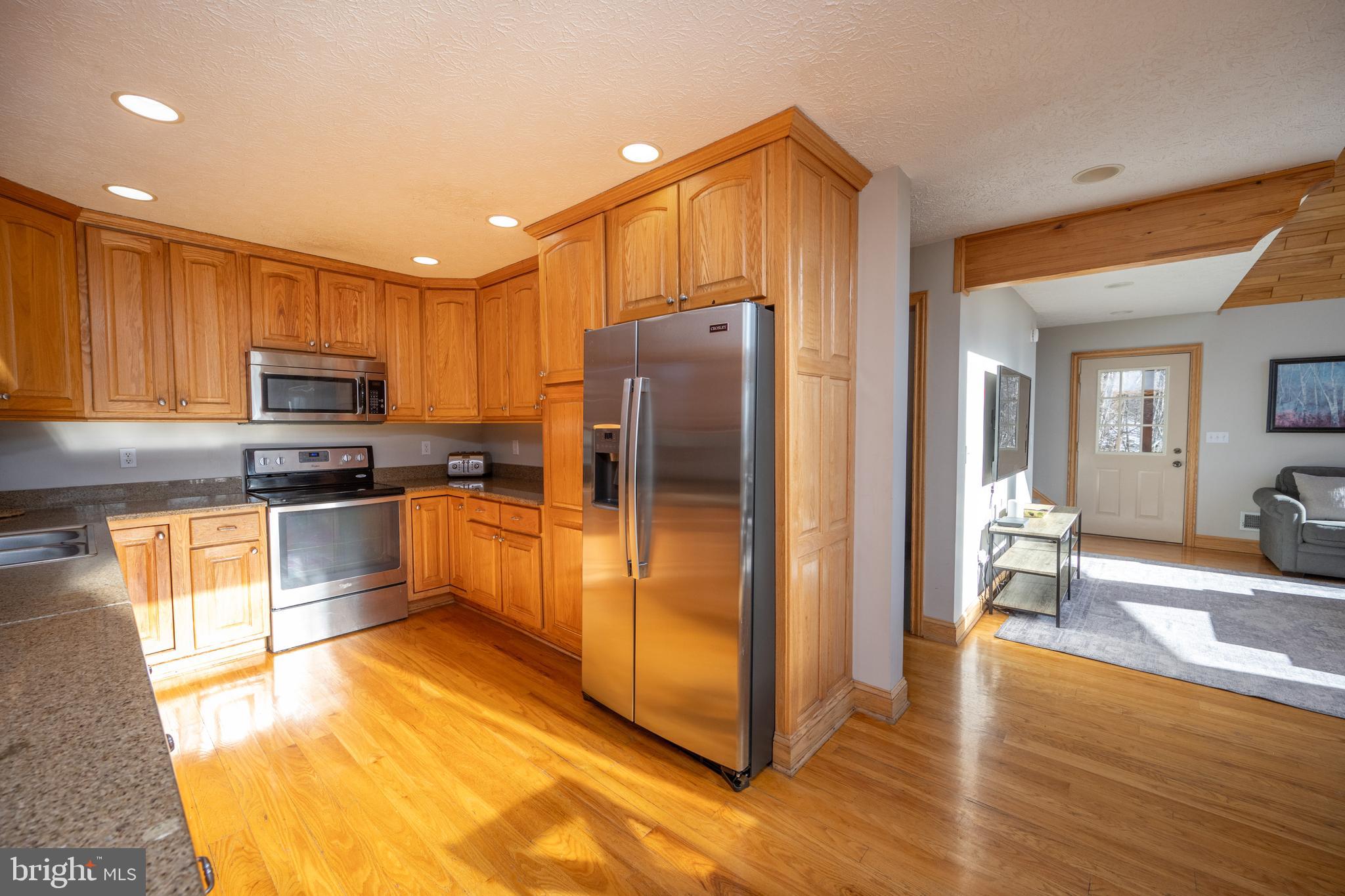 723 Pinnacle Drive Swanton, MD 21561 - Photo 13 of 112 Open to dining/living area.