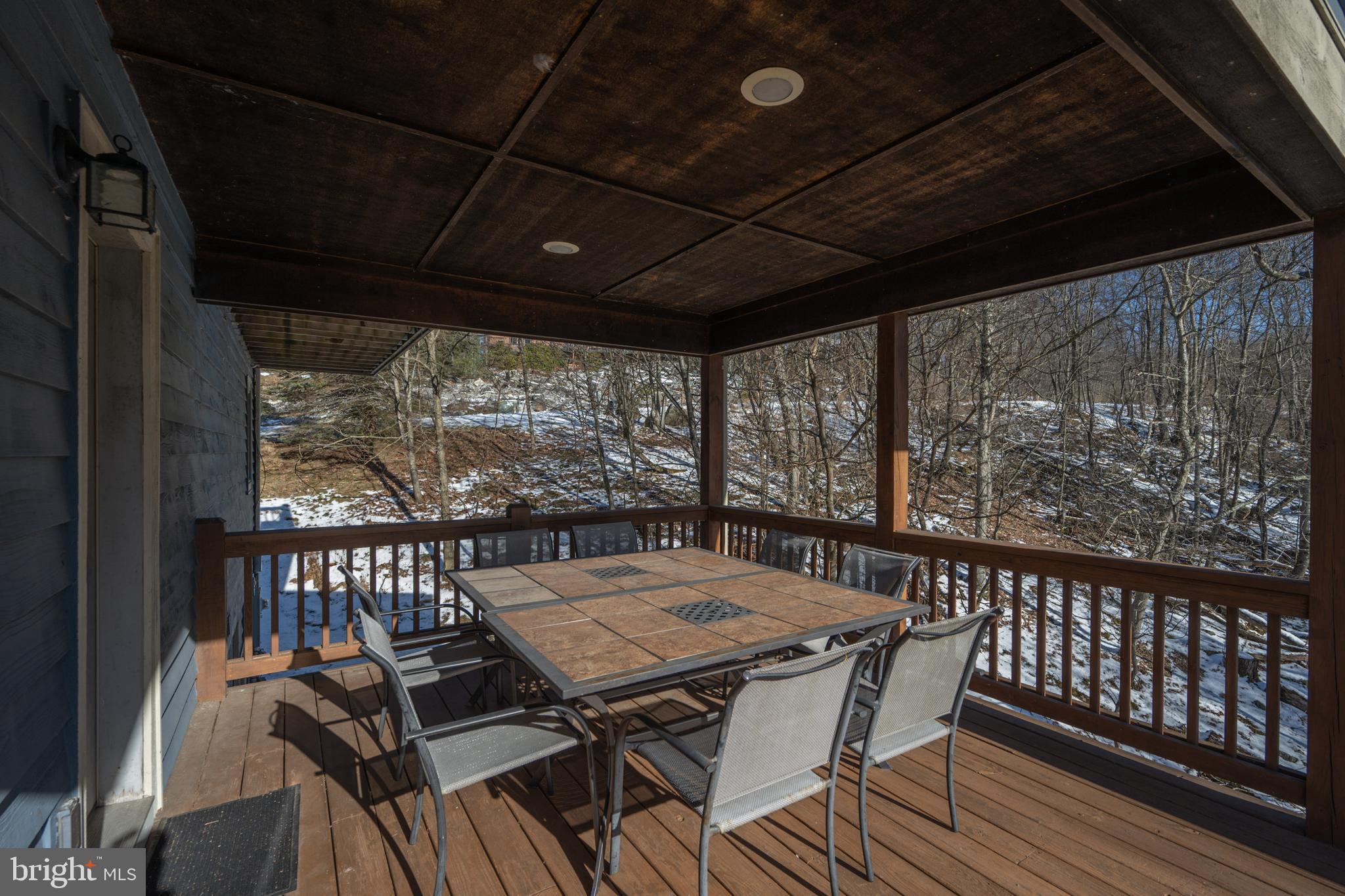 723 Pinnacle Drive Swanton, MD 21561 - Photo 27 of 107 Covered outdoor eating on the main level deck.