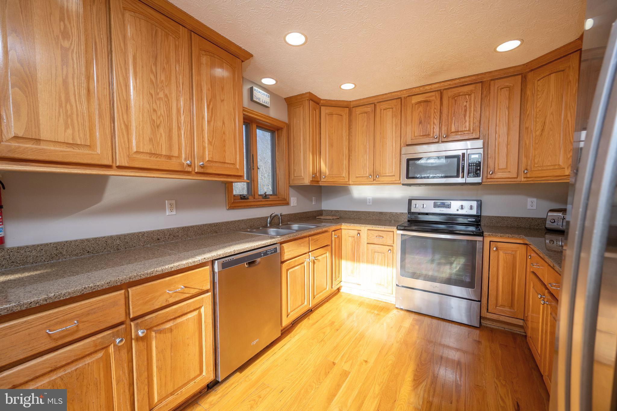 723 Pinnacle Drive Swanton, MD 21561 - Photo 9 of 107 Spacious Kitchen with Stainless steel appliances.