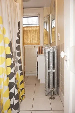 a kitchen with a refrigerator and mirror