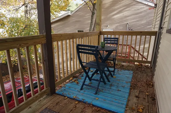a view of a balcony with chairs