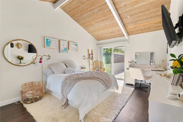 a bed room with a bed and a chair