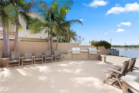 a view of a patio with a table and chairs