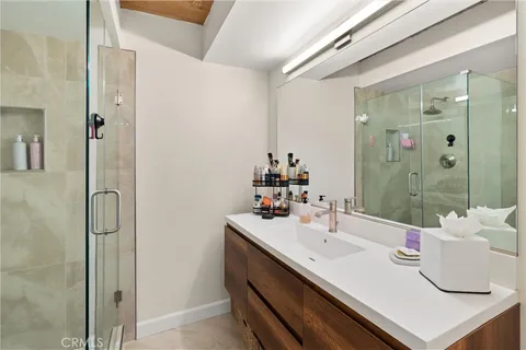 a bathroom with a sink and mirror