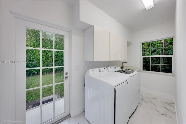 a utility room with dryer and washer