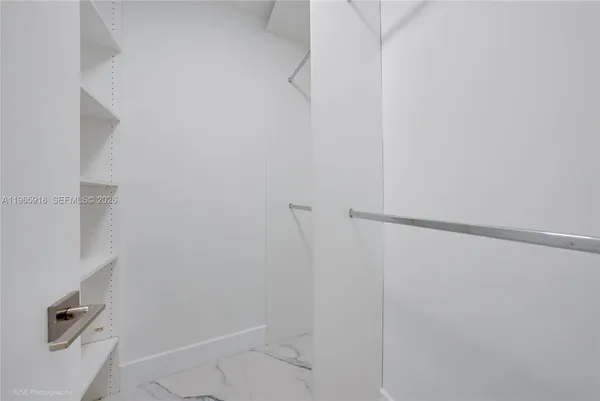 an empty room with a empty space and window