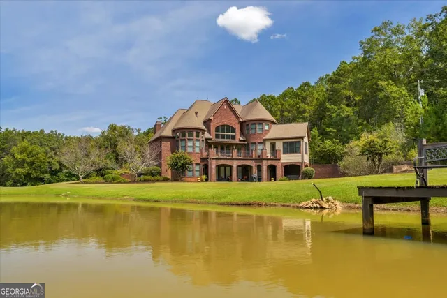 a view of a lake with a house in the background