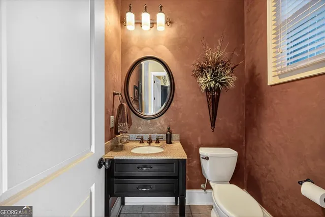 a living room with furniture a piano and a window