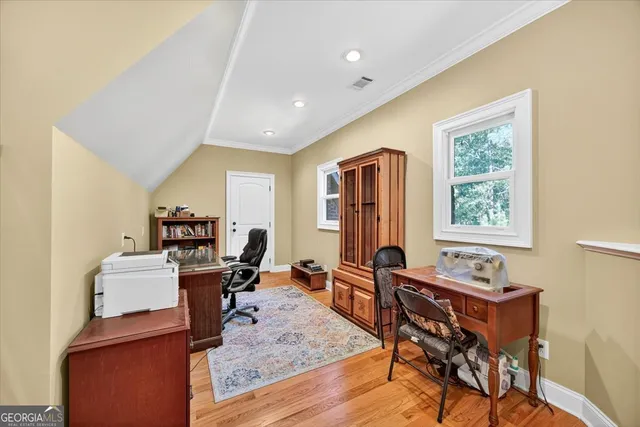 front view of a brick house with a large window