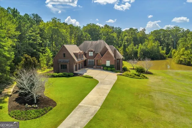 a front view of a residential apartment building with a yard