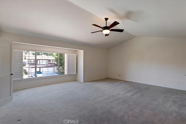 a spacious bathroom with a double vanity sink a large mirror and shower