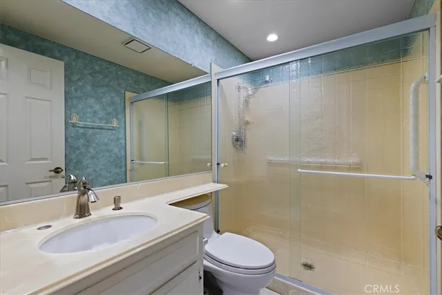 a view of a livingroom with a ceiling fan and window