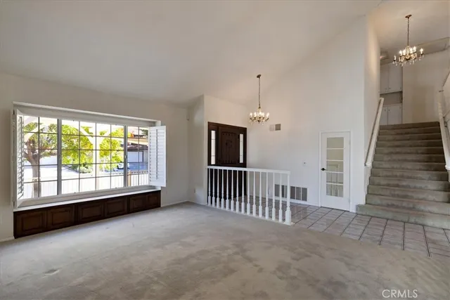 a view of a hallway with stairs