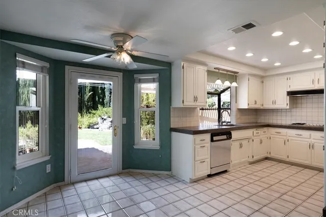 a view of a dining room with furniture and window
