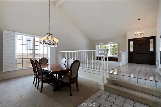 a kitchen with stainless steel appliances granite countertop a sink a stove a refrigerator and cabinets