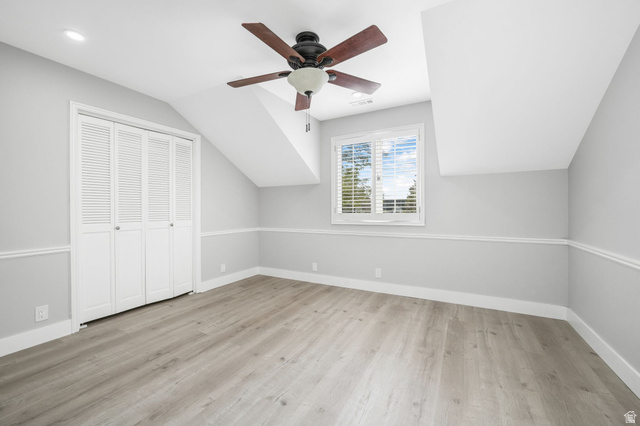 8965 Quail Run Drive Sandy, UT 84093 - Photo 21 of 56 Additional living space with ceiling fan, lofted ceiling, and light wood-type flooring