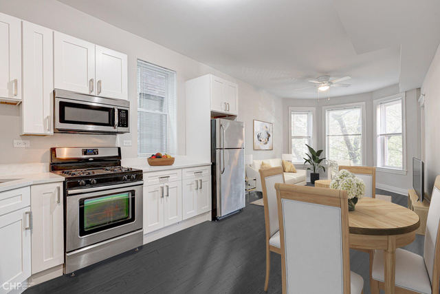 2633 West Haddon Avenue, Unit 3F Chicago, IL 60622 - Photo 3 of 12 a kitchen with a stove a sink and a refrigerator
