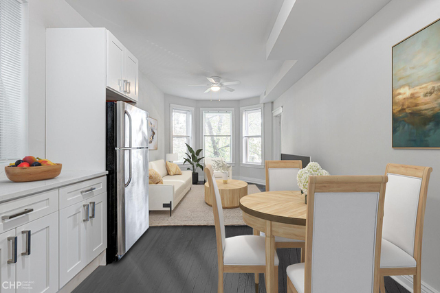 2633 West Haddon Avenue, Unit 3F Chicago, IL 60622 - Photo 4 of 12 a living room with furniture a flat screen tv and a refrigerator