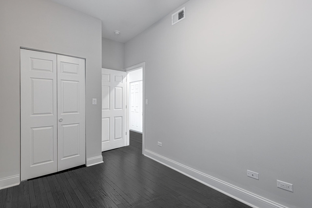 2633 West Haddon Avenue, Unit 3F Chicago, IL 60622 - Photo 7 of 12 a view of an empty room with wooden floor