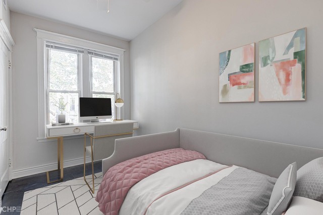 2633 West Haddon Avenue, Unit 3F Chicago, IL 60622 - Photo 10 of 12 a bedroom with a bed and a flat screen tv