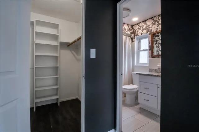 a bathroom with a toilet sink and a shower