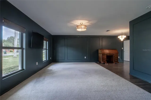 a view of a livingroom with furniture and a fireplace