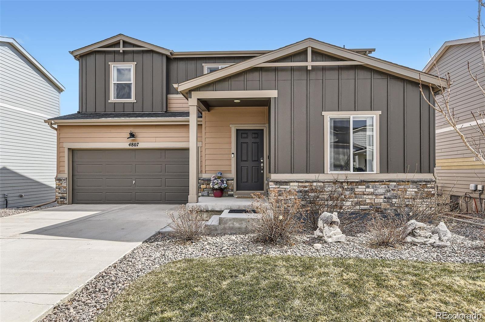 4807 River Highlands Loop Elizabeth, CO 80107 - Photo 1 of 37 a front view of a house with yard