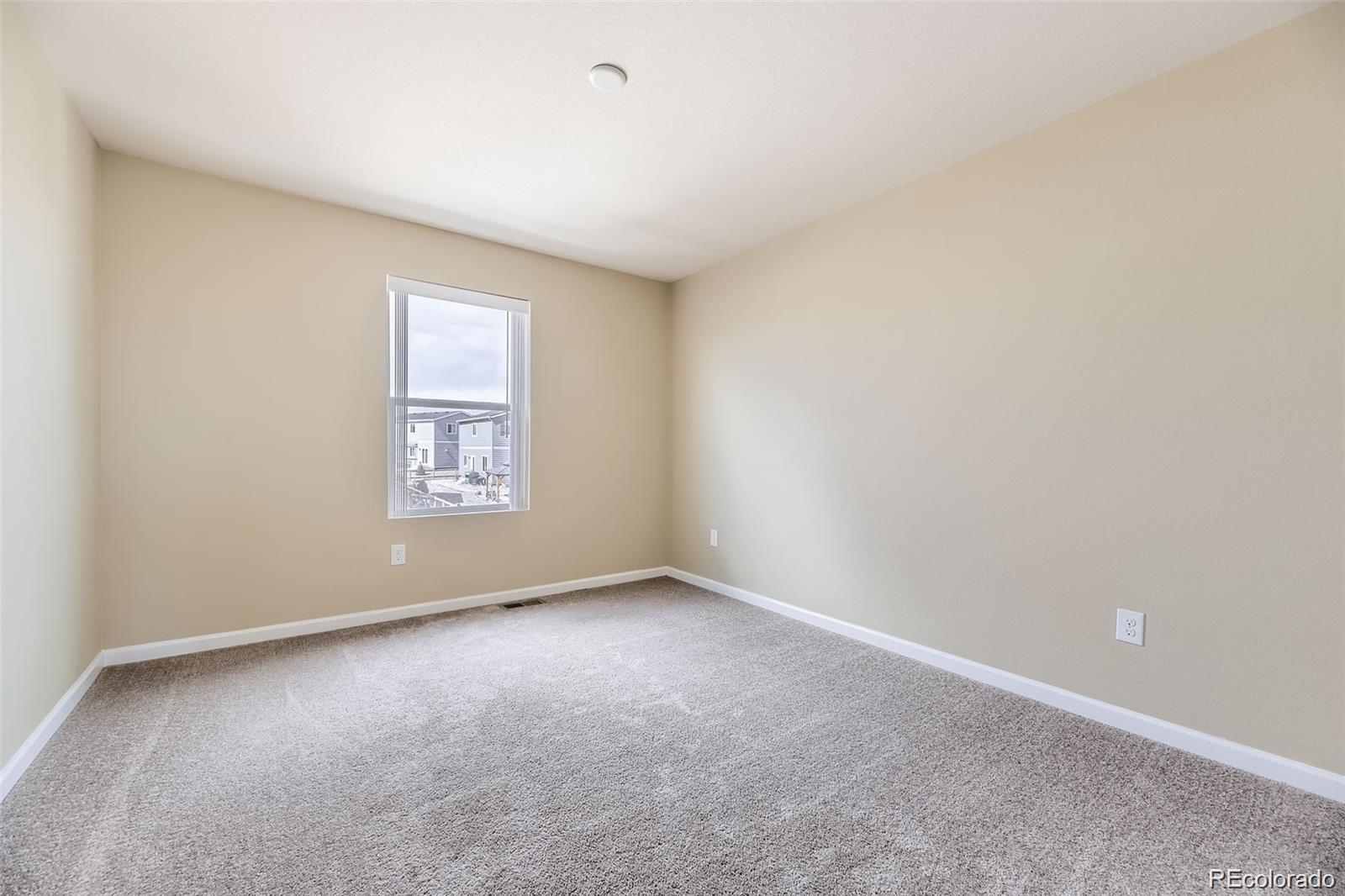 4807 River Highlands Loop Elizabeth, CO 80107 - Photo 19 of 37 an empty room with a window