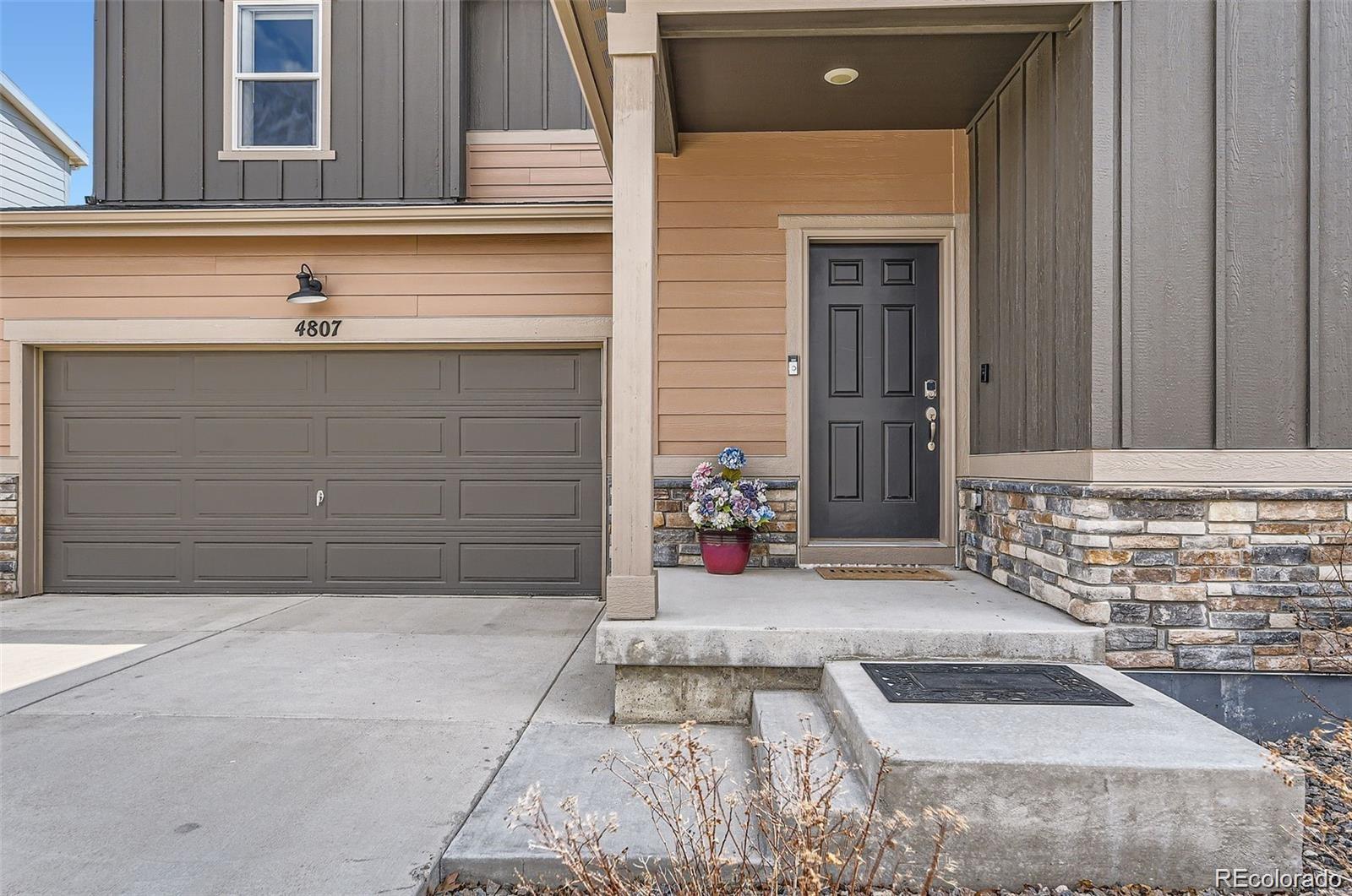 4807 River Highlands Loop Elizabeth, CO 80107 - Photo 2 of 37 a view of a house with a garage
