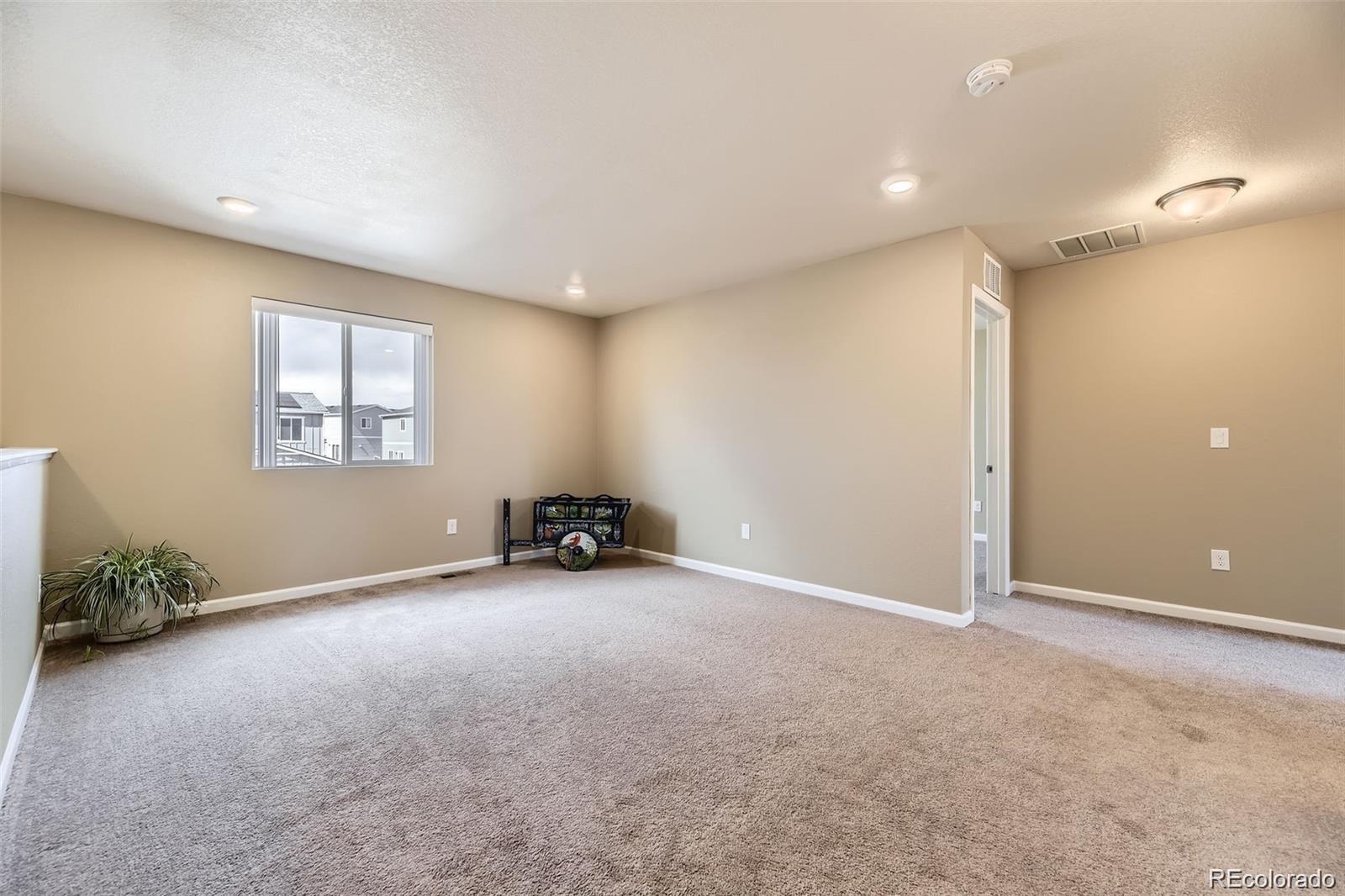 4807 River Highlands Loop Elizabeth, CO 80107 - Photo 23 of 37 an empty room with windows and closet