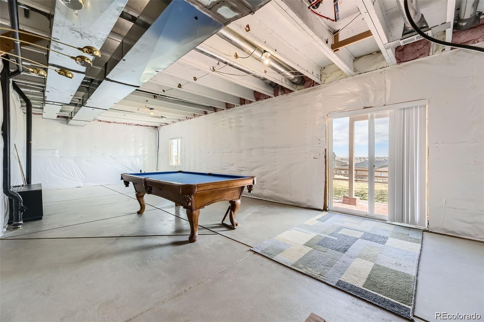 4807 River Highlands Loop Elizabeth, CO 80107 - Photo 24 of 37 a view of an empty room with windows