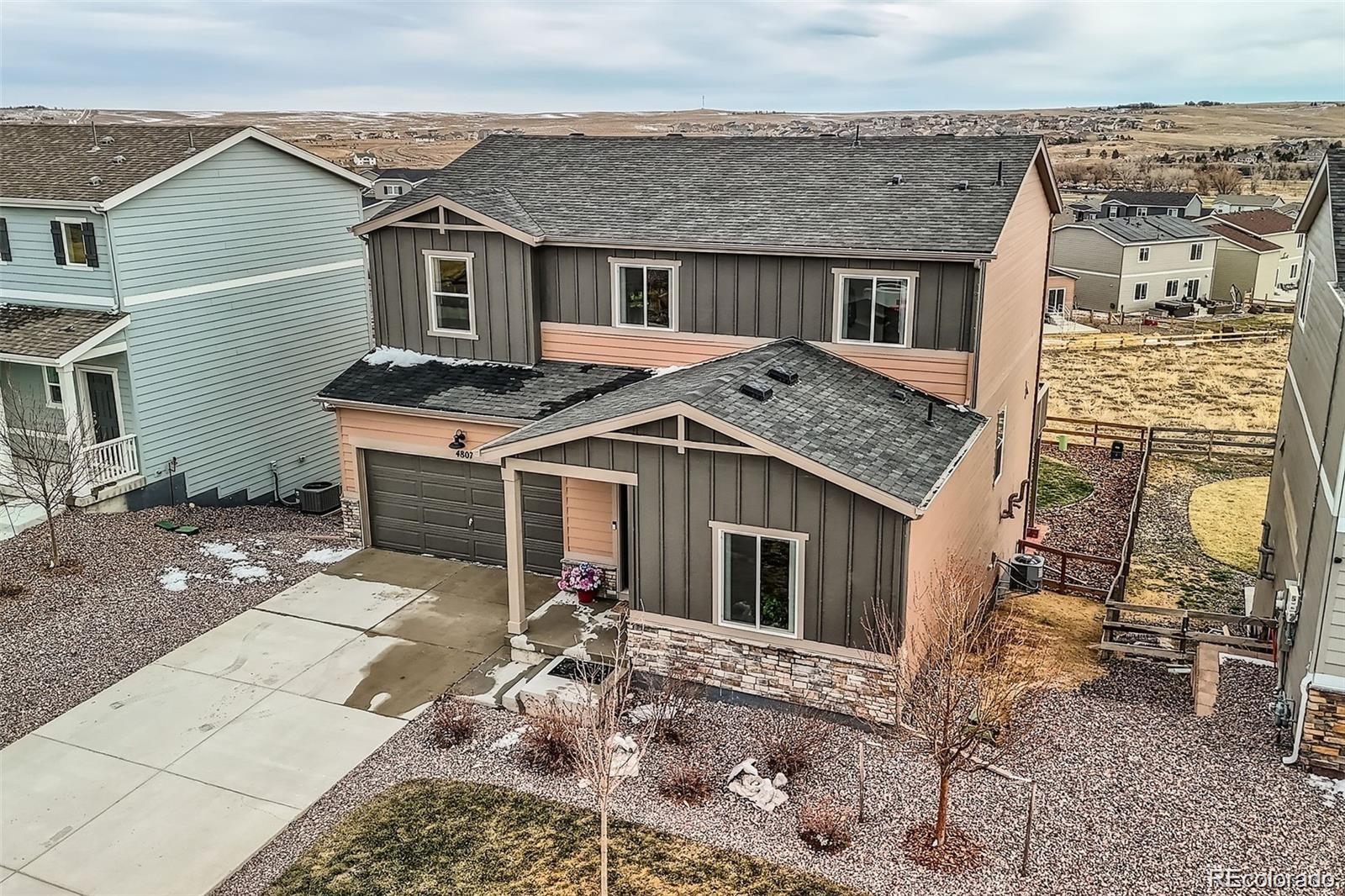 4807 River Highlands Loop Elizabeth, CO 80107 - Photo 27 of 37 a view of a house with a patio