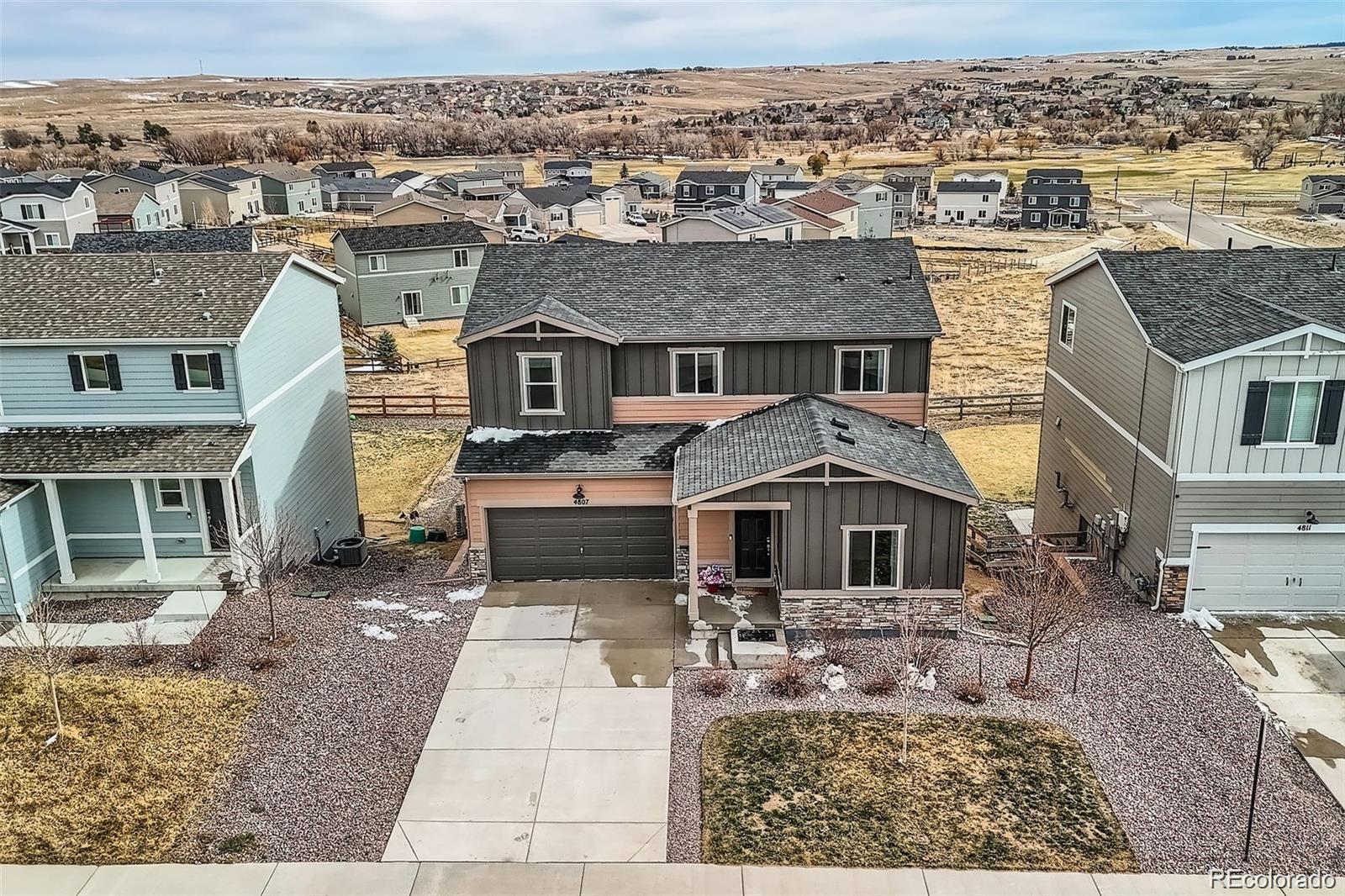 4807 River Highlands Loop Elizabeth, CO 80107 - Photo 3 of 37 an aerial view of a house with a yard