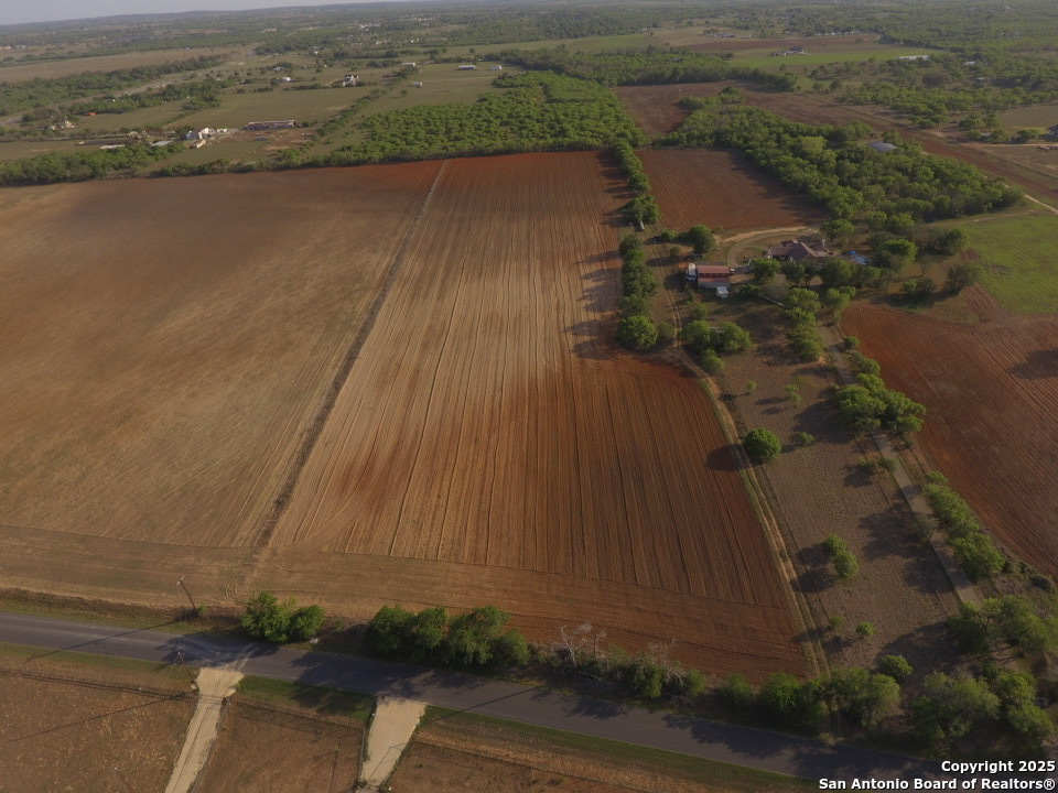 an aerial view of a houses with ocean view