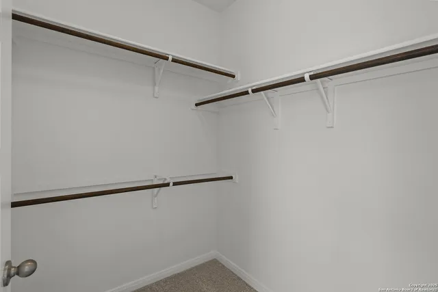 a view of a room with racks on the wall