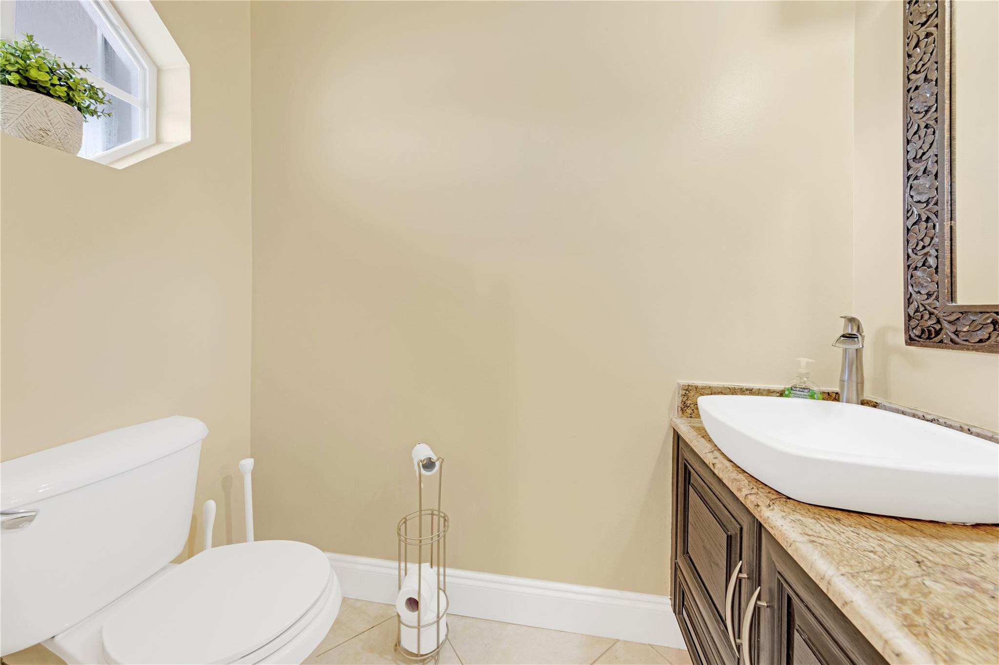 8310 Via Leonessa Boca Raton, FL 33433 - Photo 11 of 29 a bathroom with a granite countertop sink and a toilet